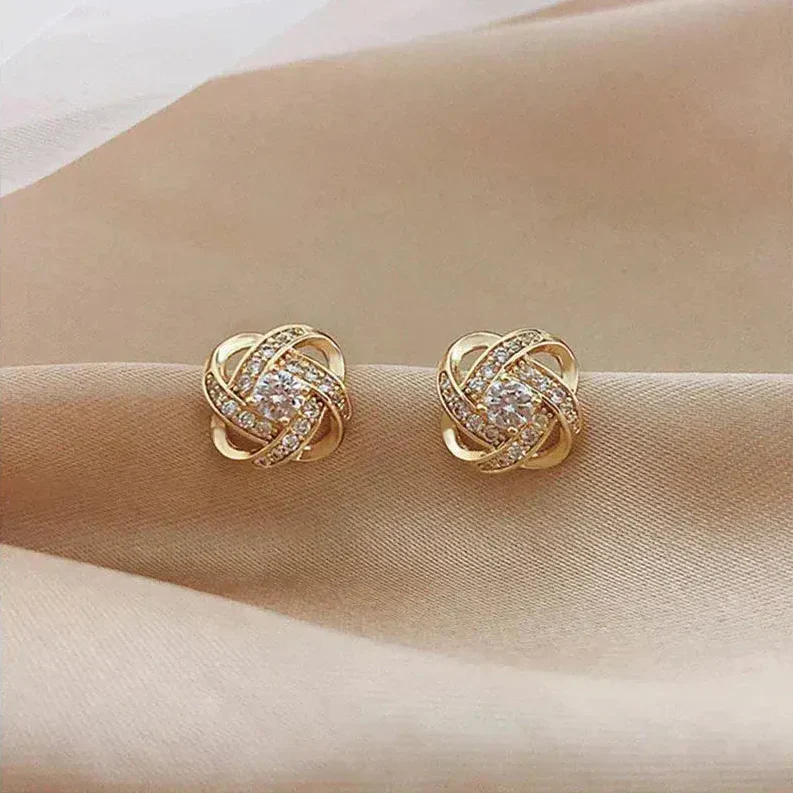 Goldene Spiralförmige Blüten-Ohrringe mit Kristallen