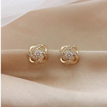 Goldene Spiralohrringe mit Kristallen