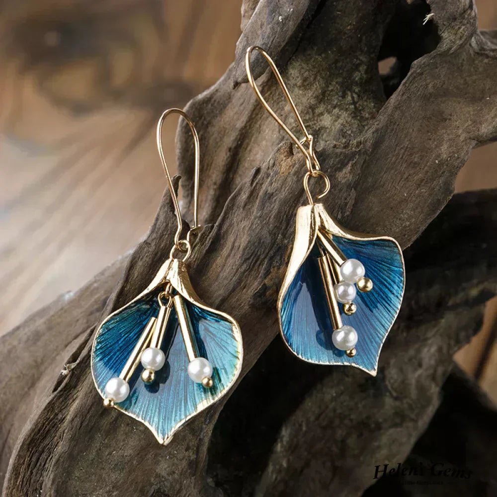 Ohrringe in Gold und Blau mit Perlen